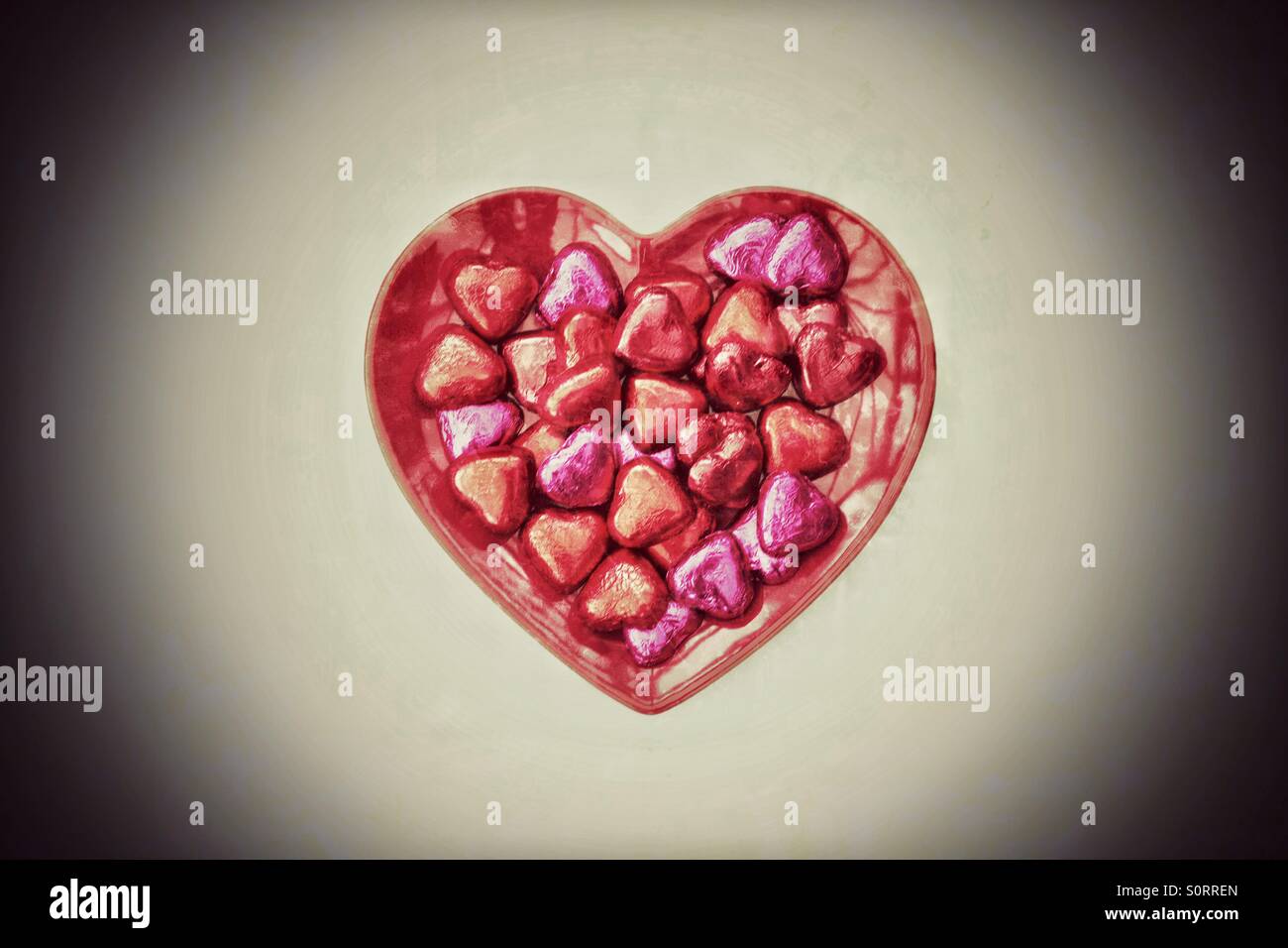 Valentine's Day chocolates on a heart shaped plate. - Smartphone Captured Stock Image