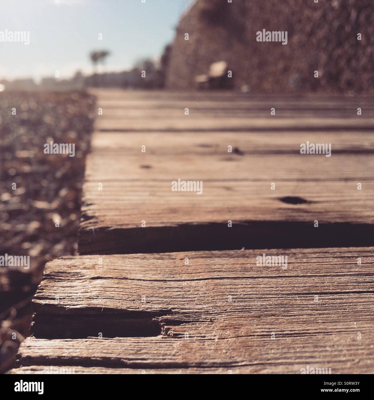 Wood walk by a stone beach in Benicassim, Spain Stock Photo