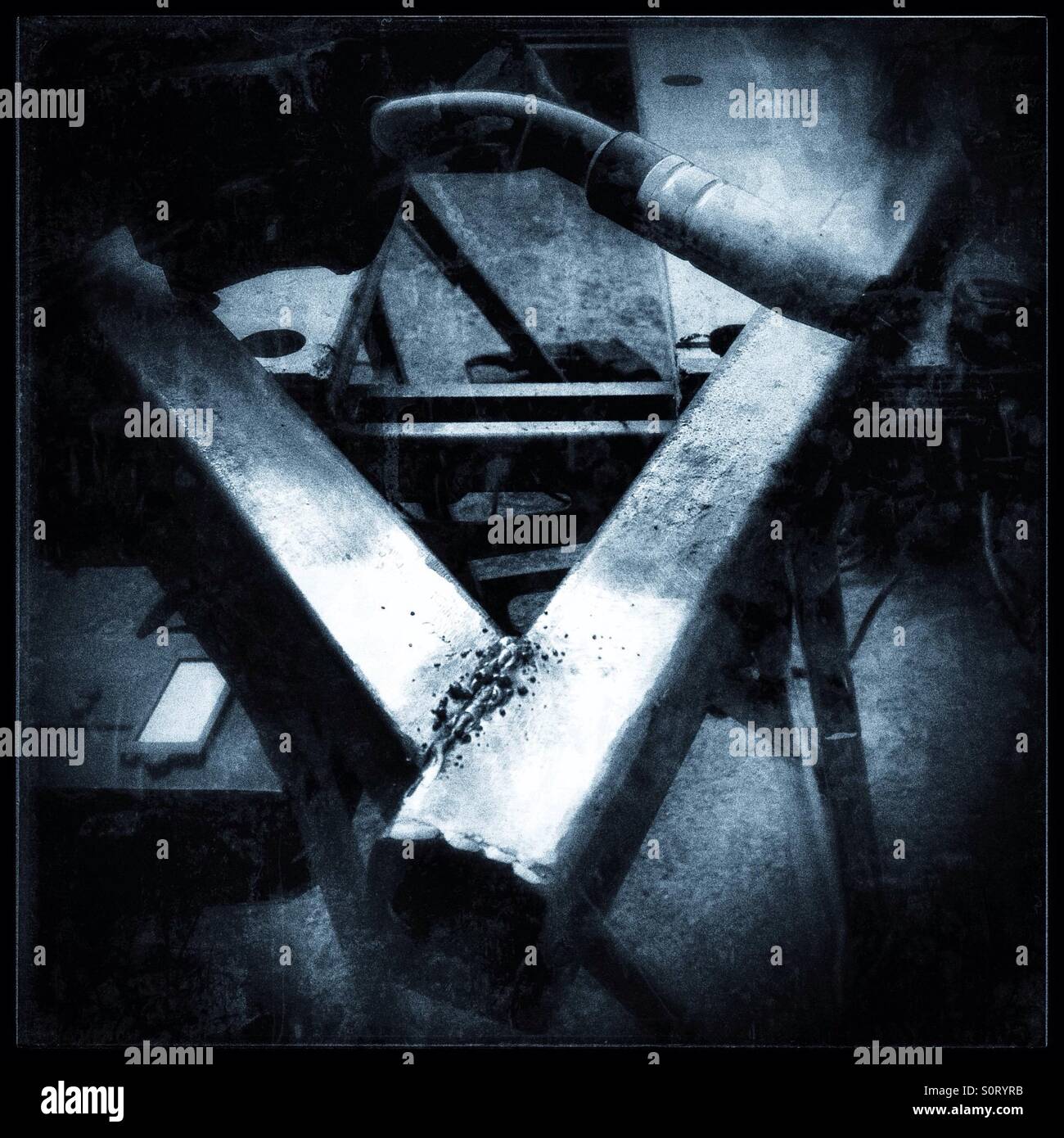 Welding with a gasless welder. - Smartphone Captured Stock Image