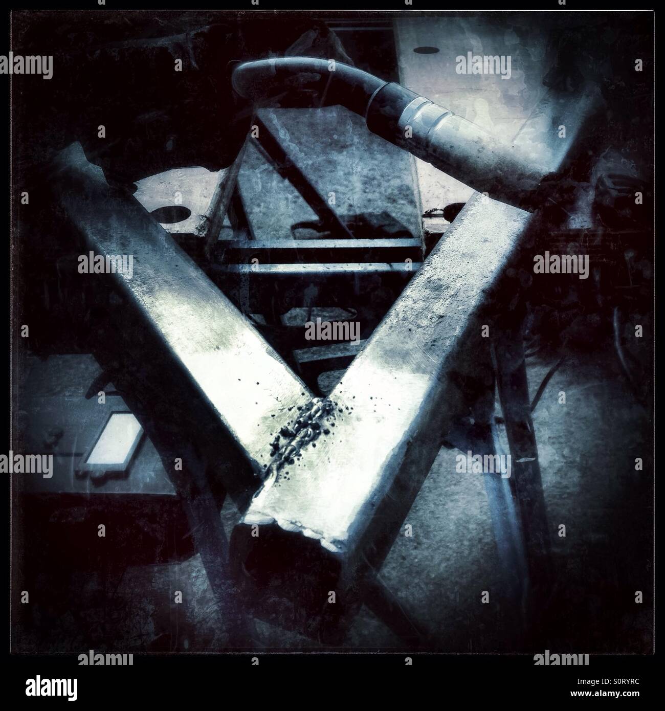 Welding with a home welder. - Smartphone Captured Stock Image