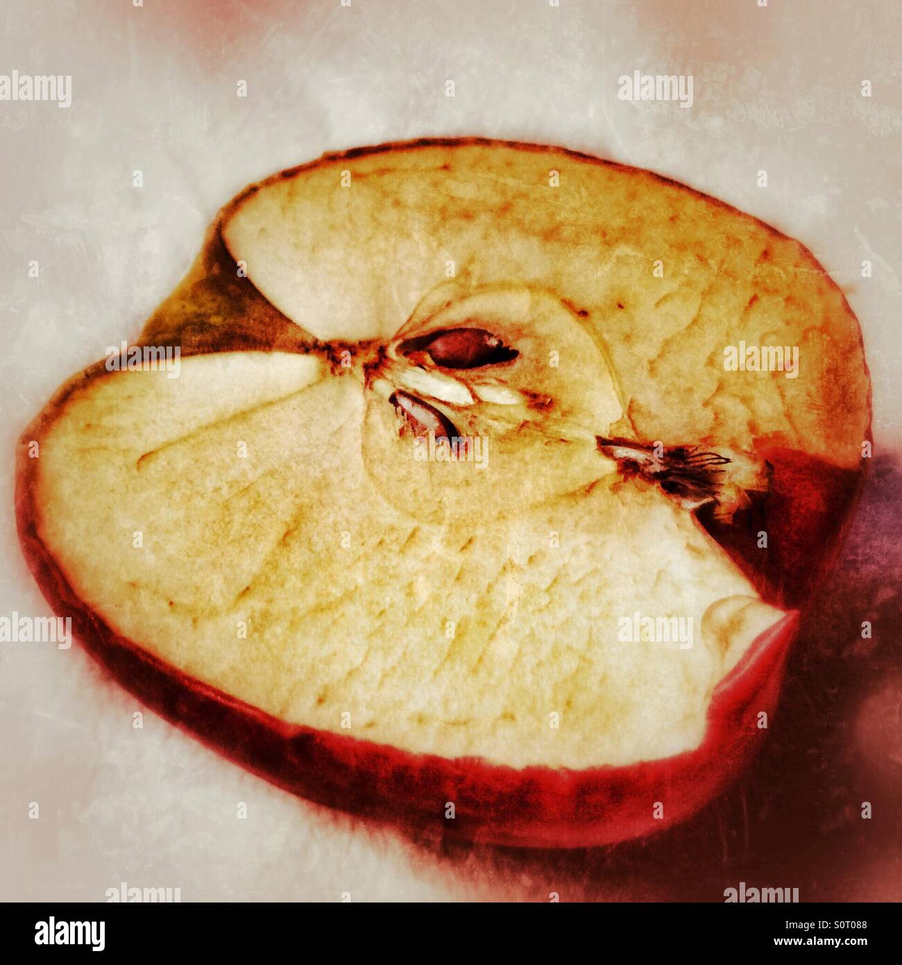 An apple cut in half and has oxidised. - Smartphone Captured Stock Image