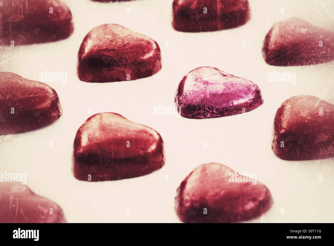 Rows of heart shaped Valentine chocolates that appear to be floating. - Smartphone Captured Stock Image