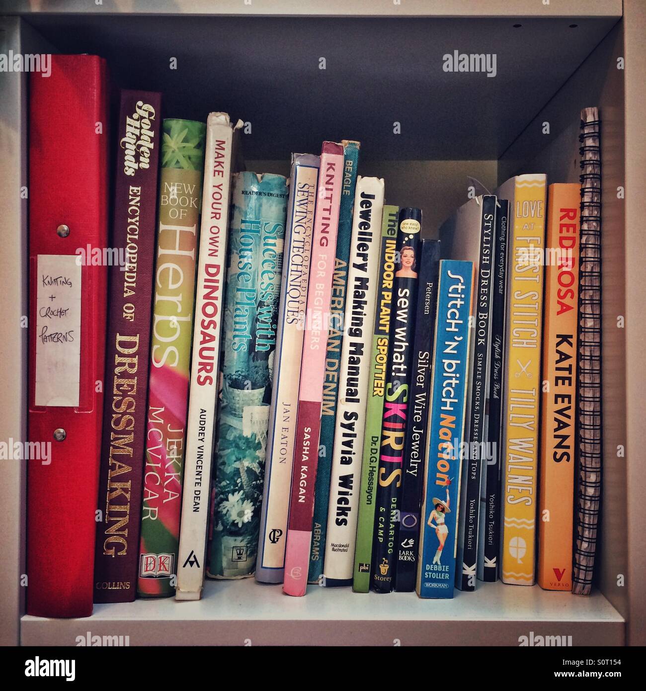 A Bookshelf Full Of Craft And Gardening Books Stock Photo