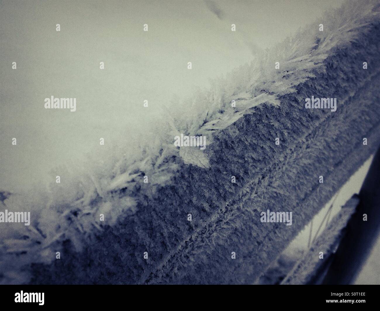 Frost ice crystals on fence in winter - Smartphone Captured Stock Image