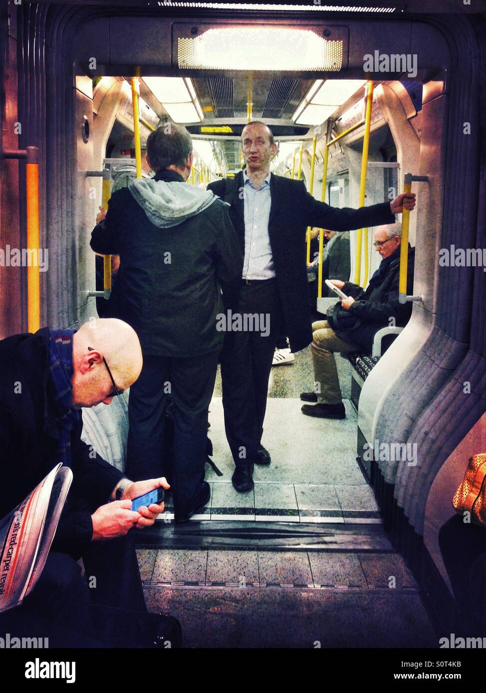 Passengers on a London Underground train. - Smartphone Captured Stock Image