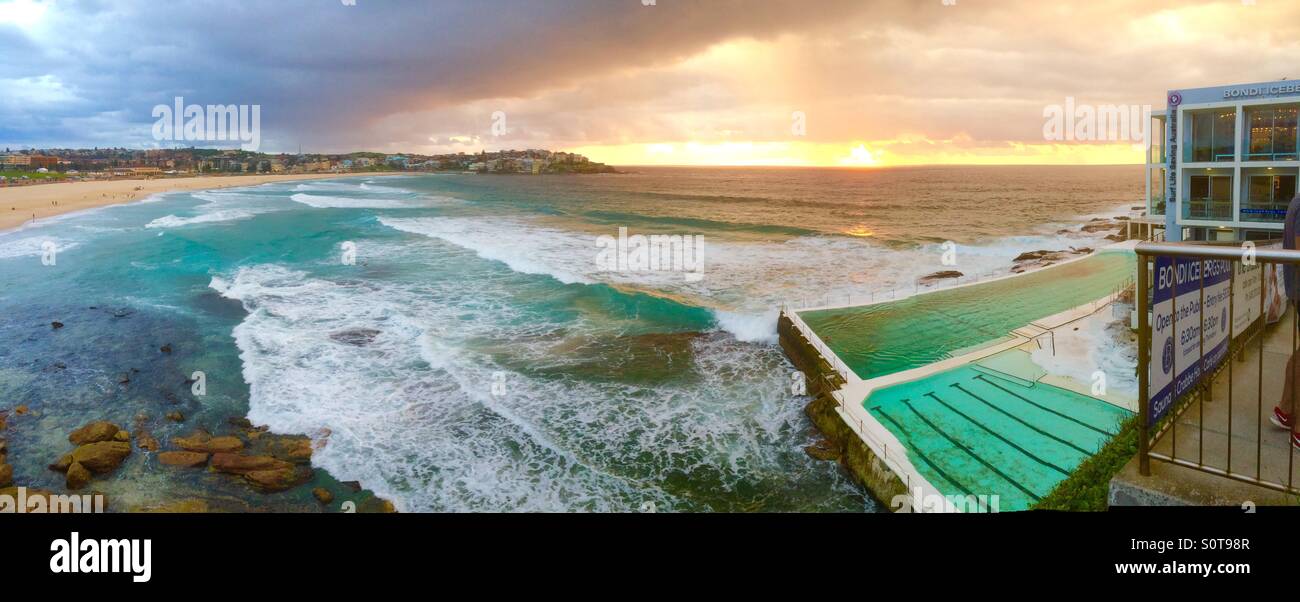 A panoramic shot of Bondi Beach and the Bondi Icebergs club and pool on Australia Day January 26th 2016 at 6.00am - Smartphone Captured Stock Image