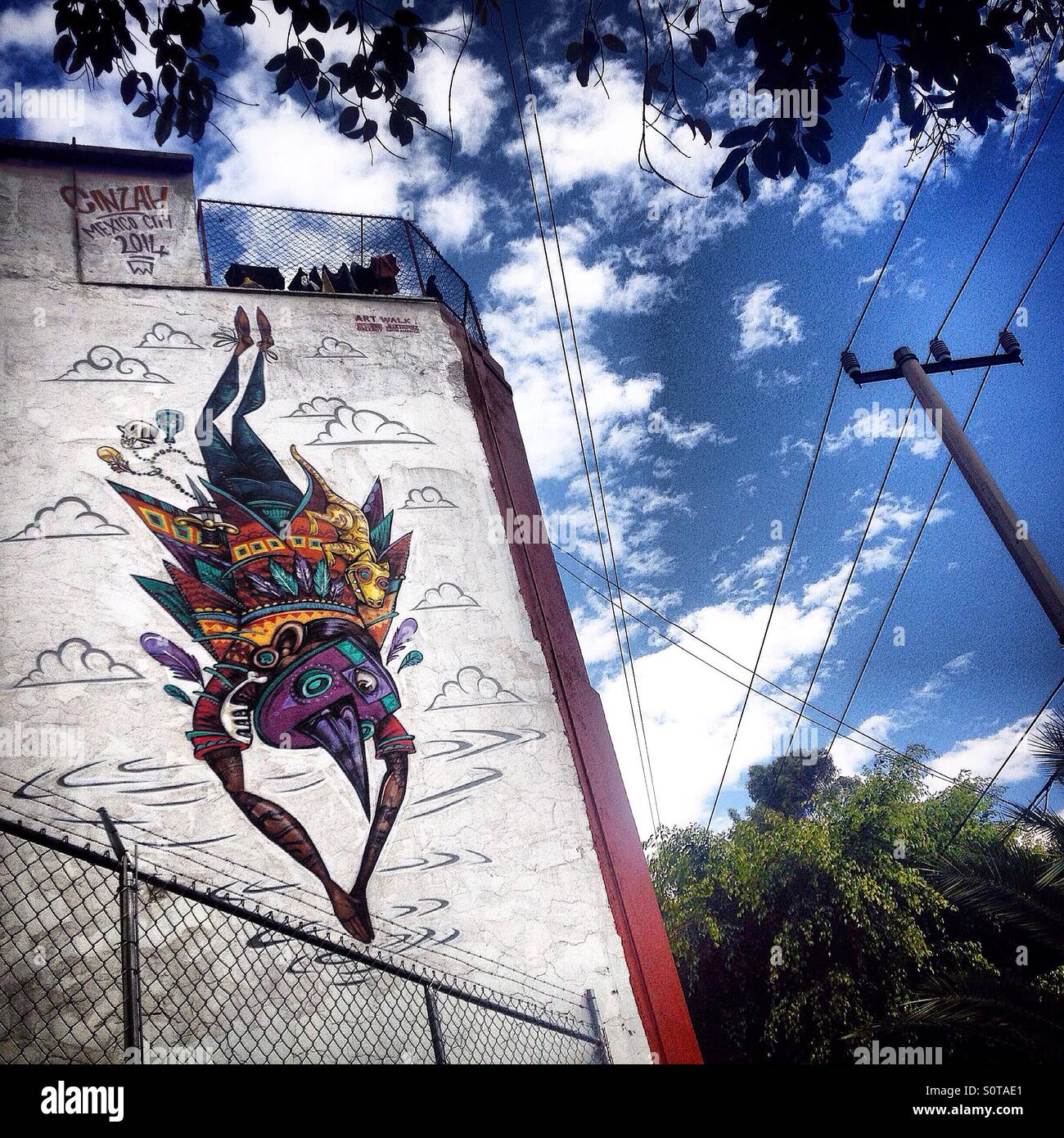 A mural of a fantastic mosquito falling decorates a wall in Colonia Roma, Mexico City, Mexico - Smartphone Captured Stock Image