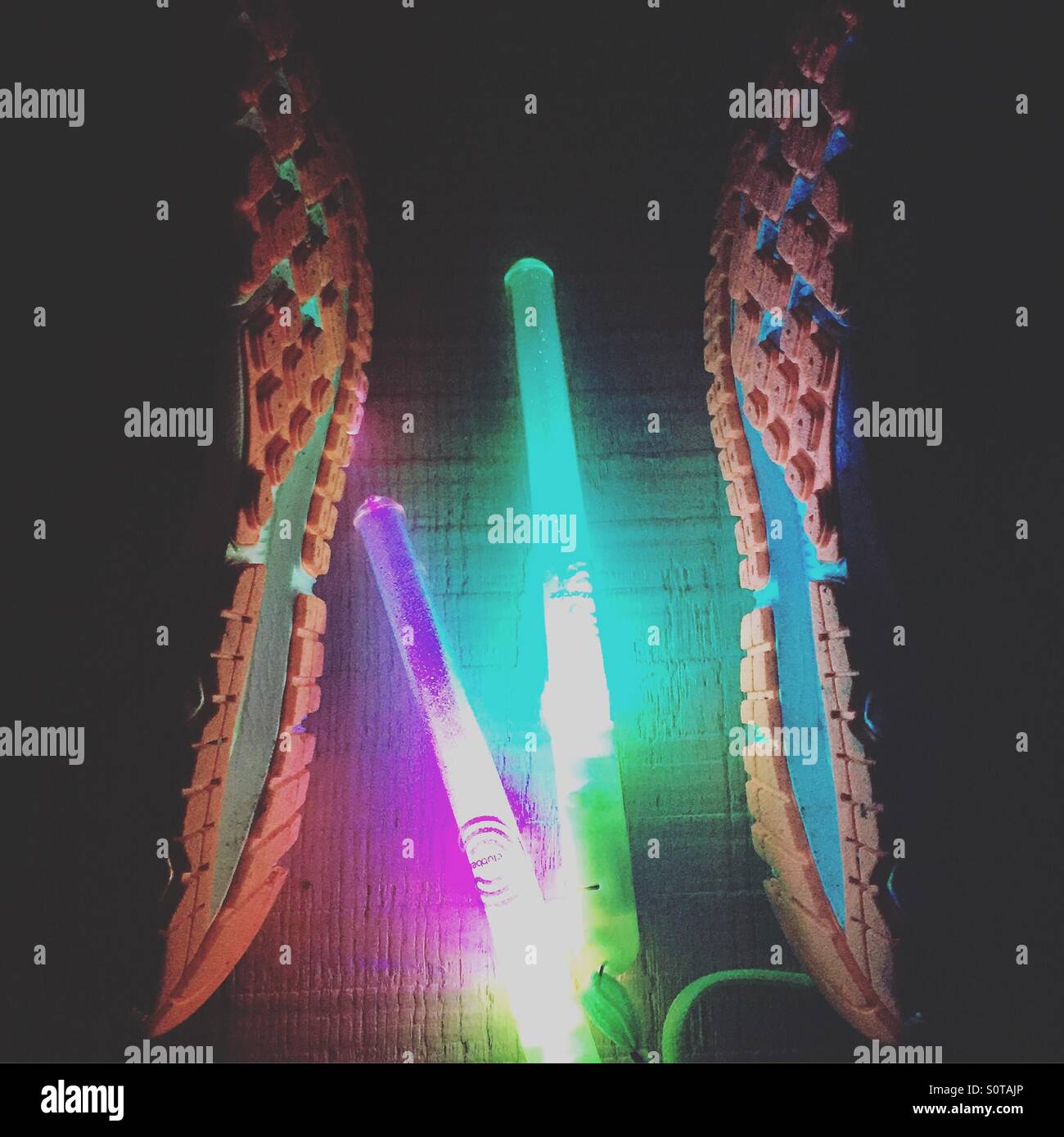Glow sticks and trainers Stock Photo Alamy