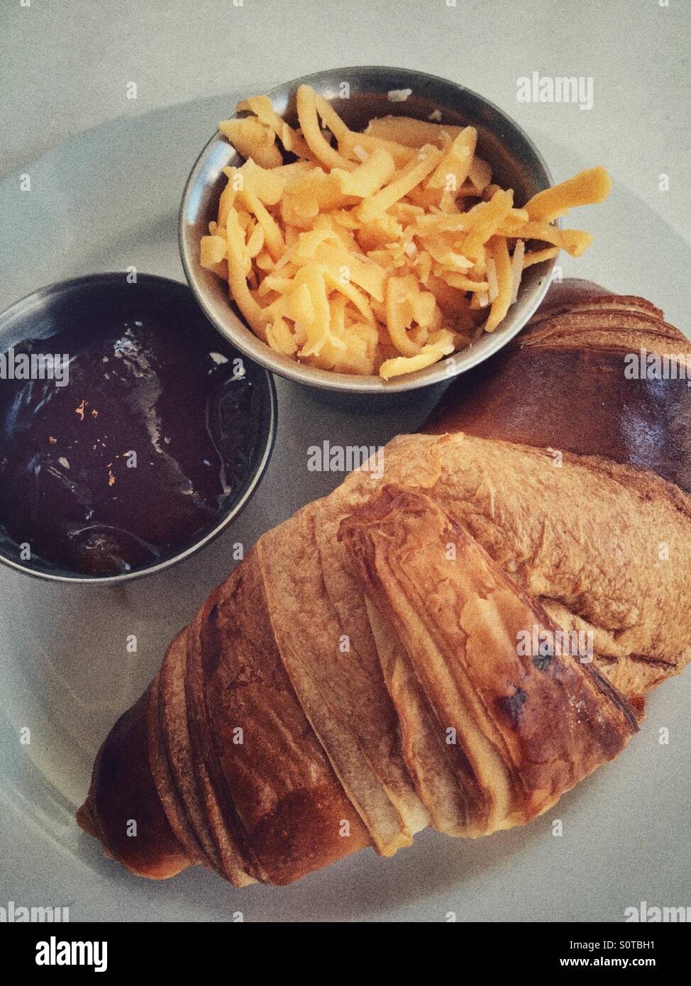 Breakfast consisting of croissant, cheese and jam Stock Photo Alamy