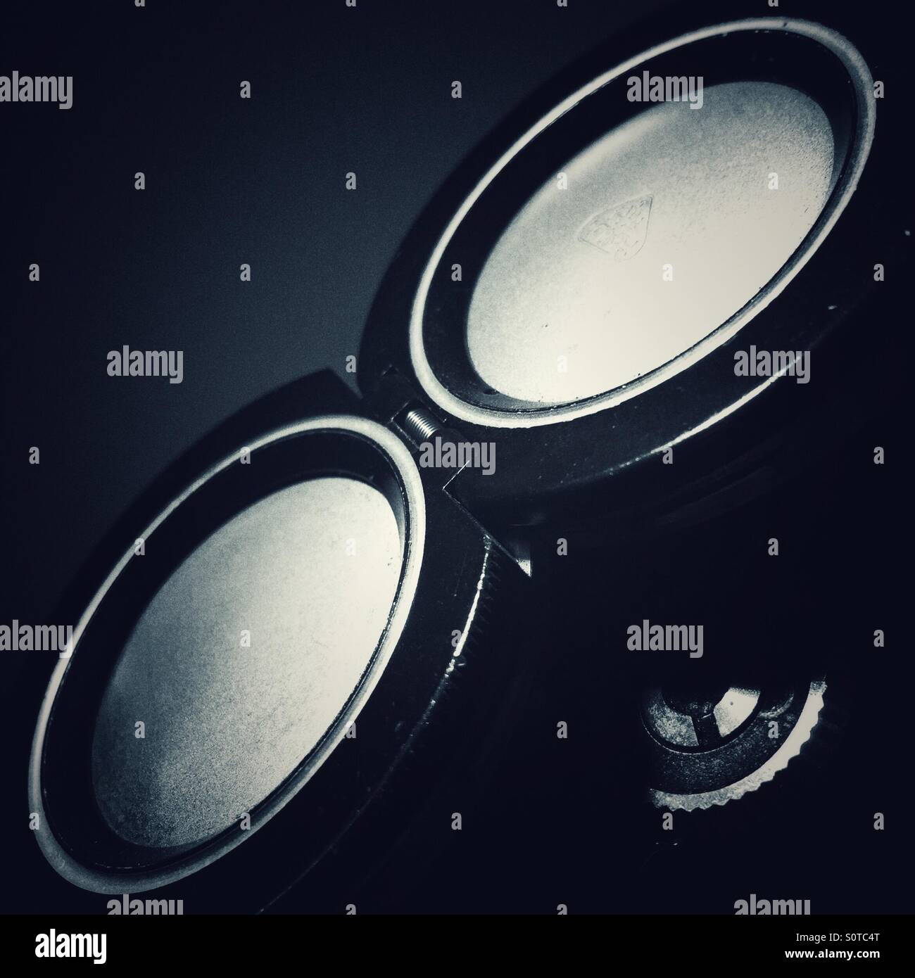 Lens covers on a vintage twins lens reflex camera - Smartphone Captured Stock Image