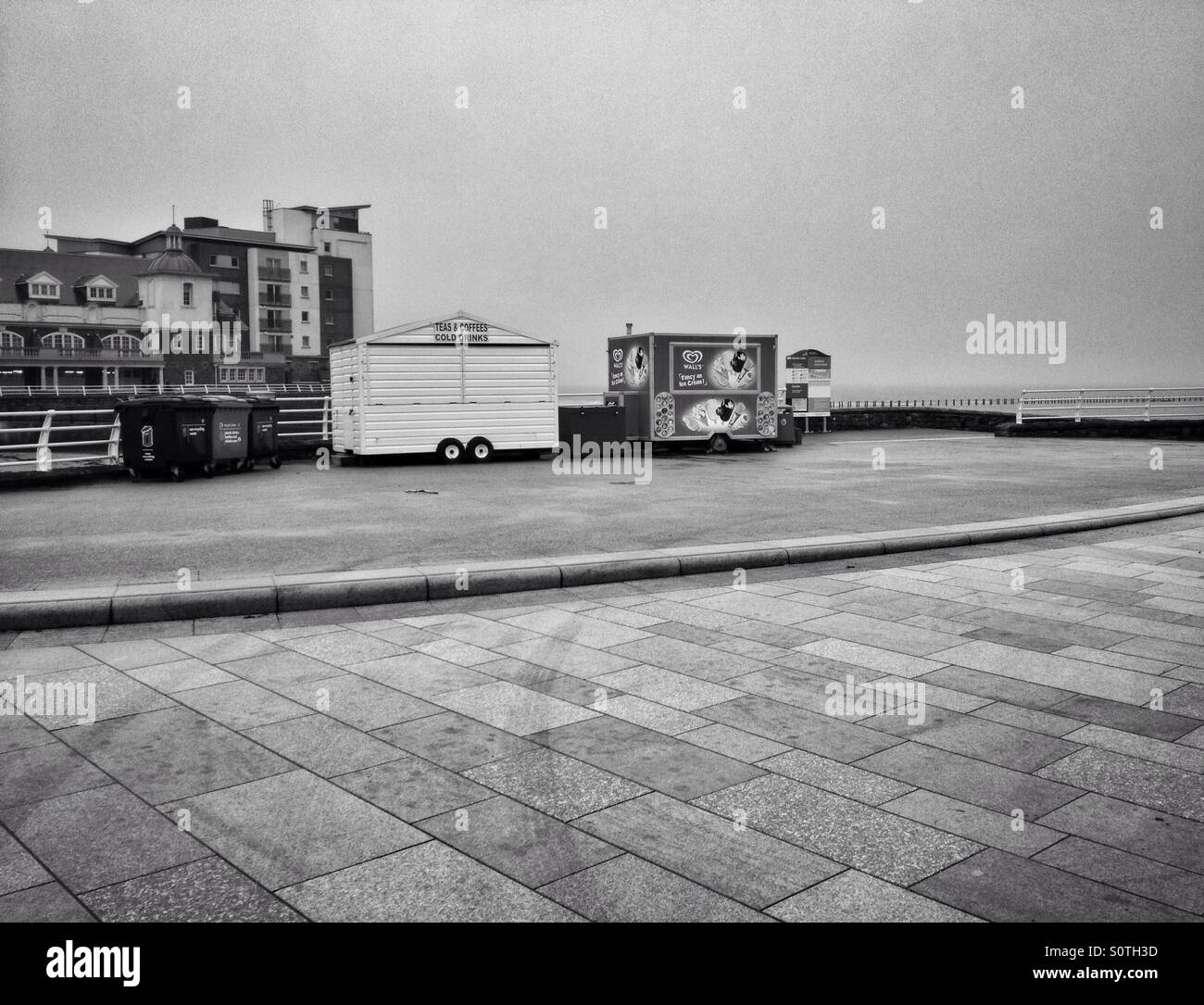 The deserted seafront at Weston-super-Mare, England, on a dull, damp day in winter. - Smartphone Captured Stock Image