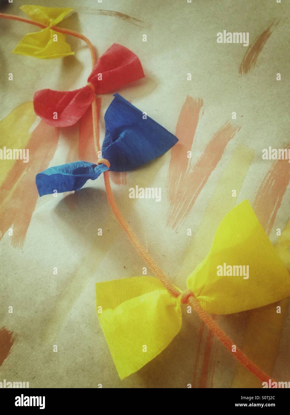 Colourful garland with bowknots - Smartphone Captured Stock Image