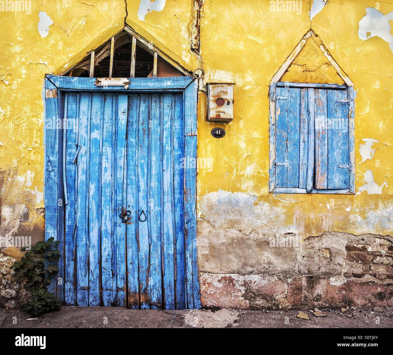 blue colored door and window of an old house Stock Photo - Alamy