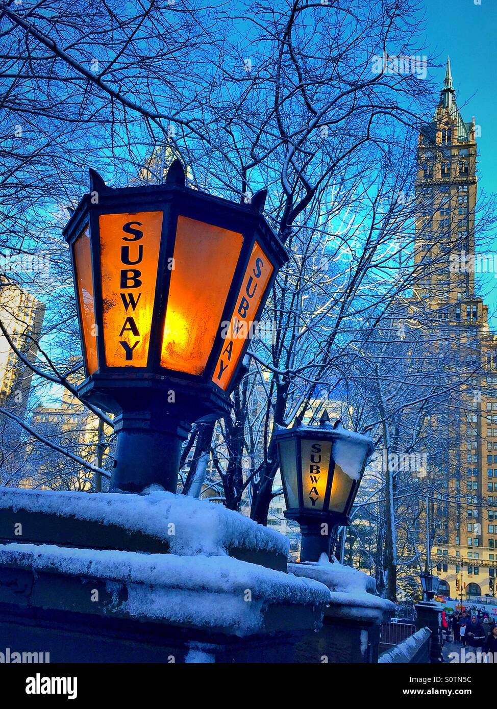 Vintage lanterns Mark and entrance to a subway station in a snowstorm in New York City, USA - Smartphone Captured Stock Image