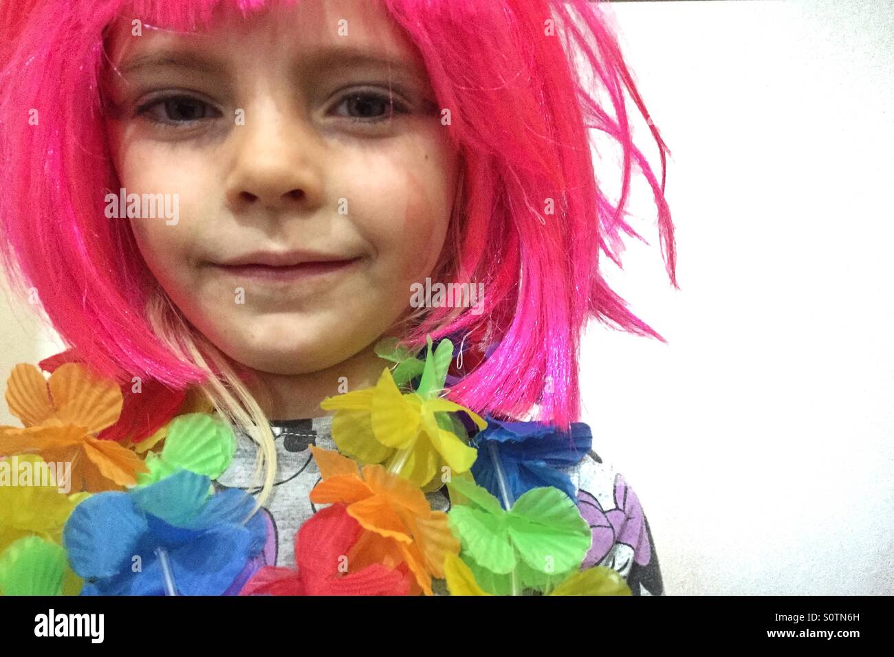 Girl in a pink wig Stock Photo