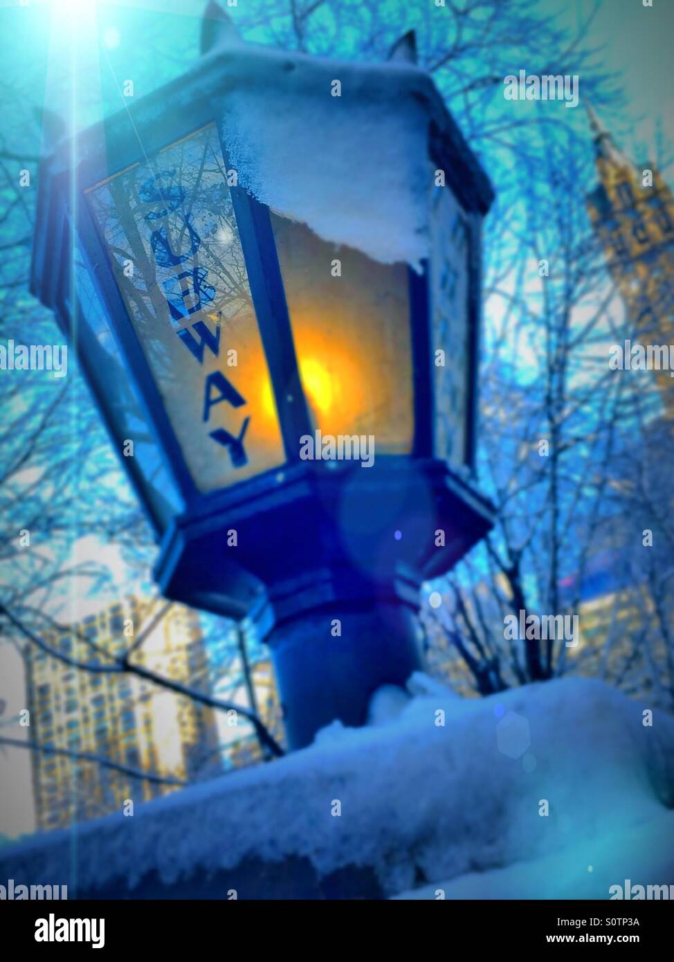 Vintage New York City subway lamp in a February snowstorm - Smartphone Captured Stock Image
