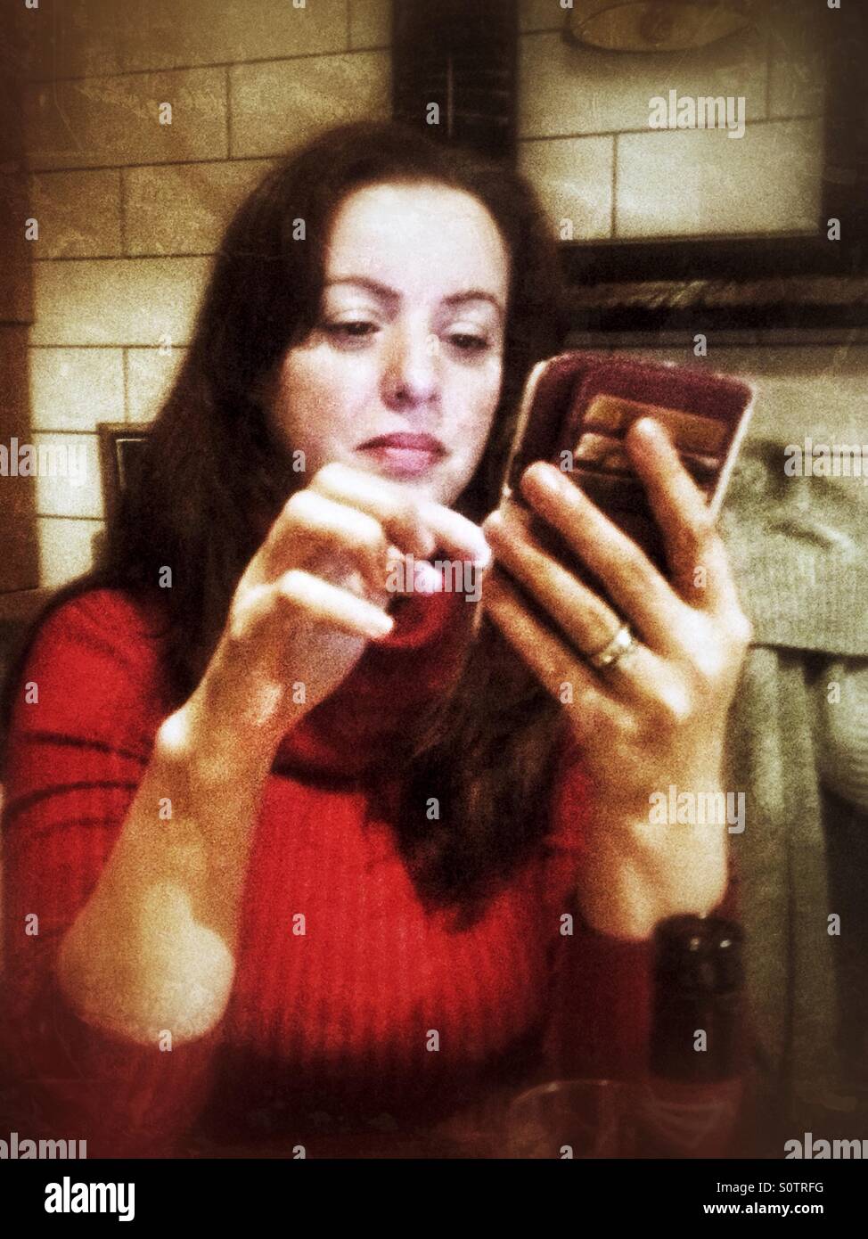 Ladies using a smartphone. - Smartphone Captured Stock Image