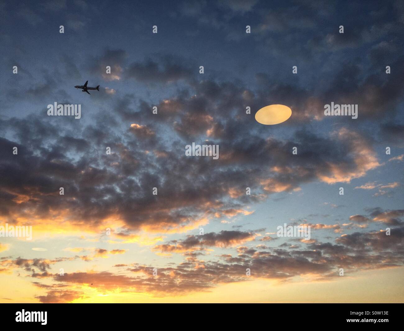 Airplane flying in a sky - Smartphone Captured Stock Image Airplane flying in a sky - Smartphone Captured Stock Image