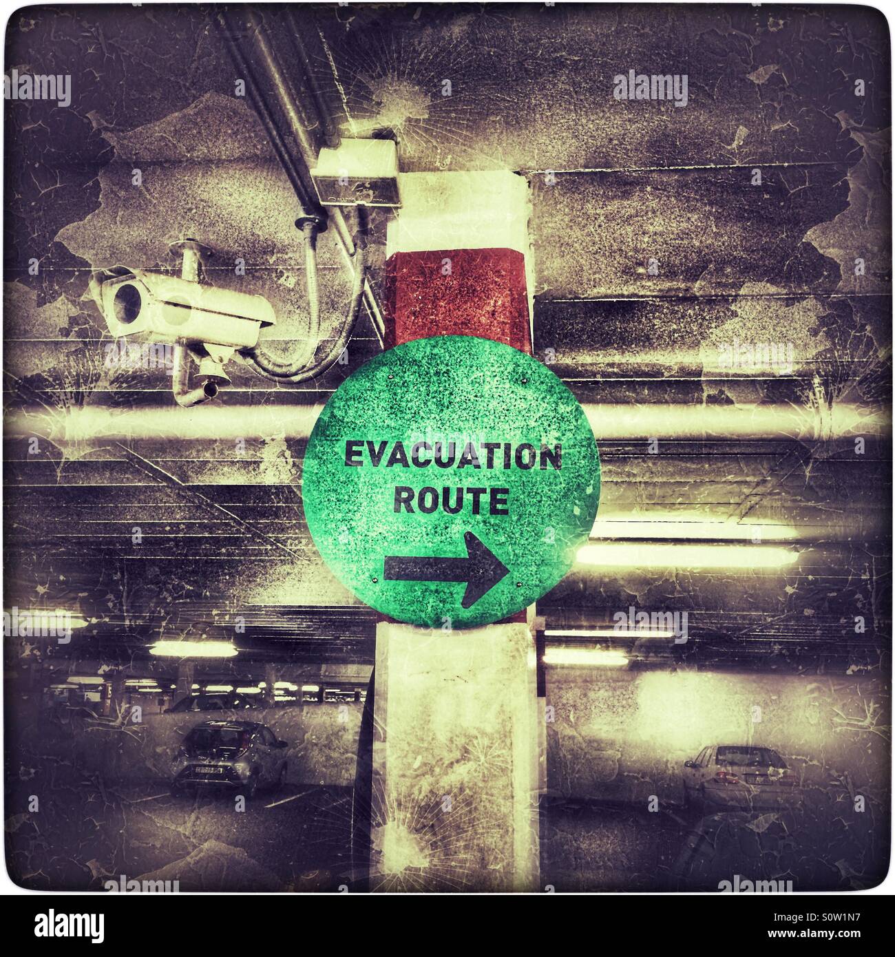 Evacuation route sign in carpark. - Smartphone Captured Stock Image