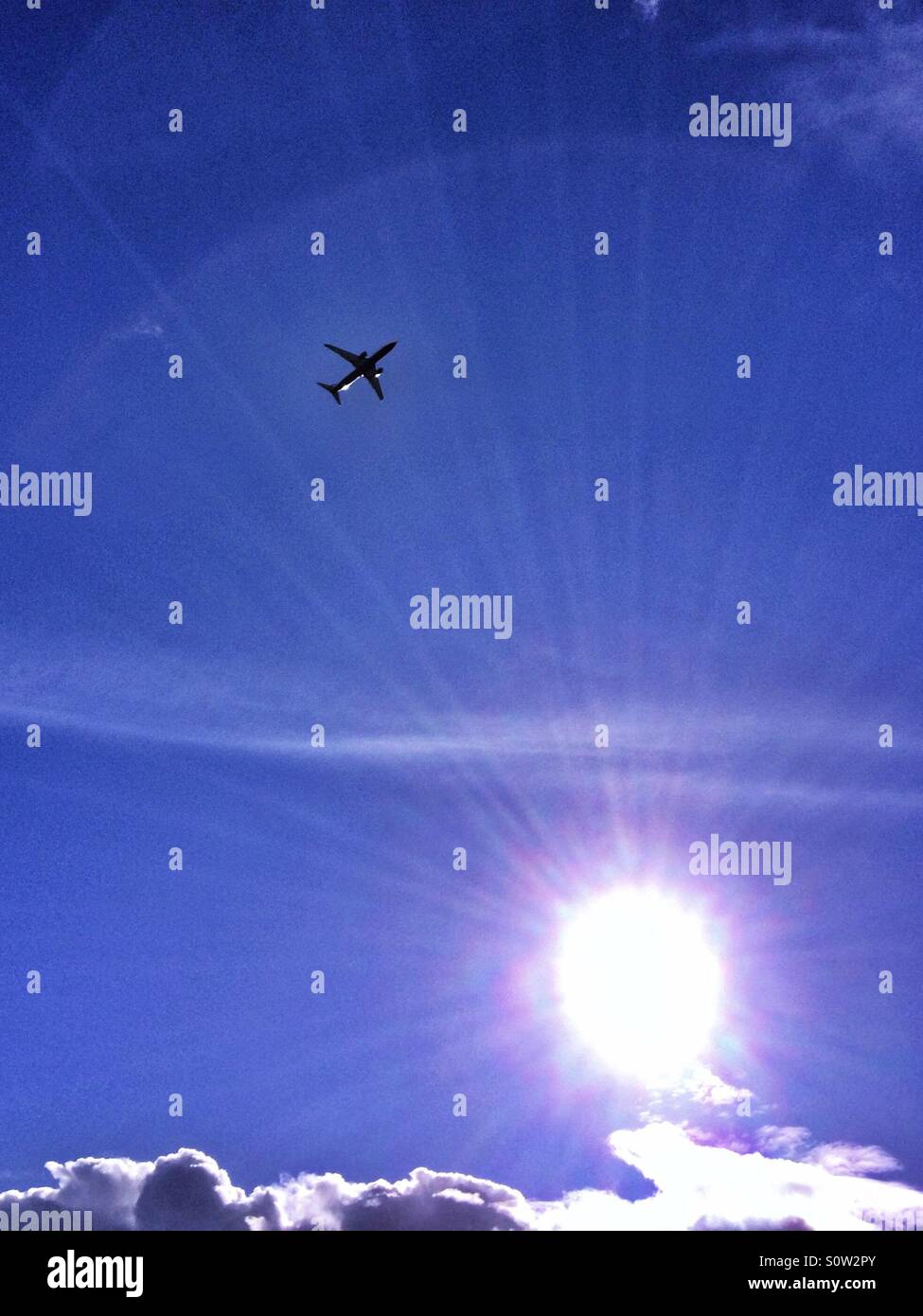 Aircraft flying on a sunny winter day - Smartphone Captured Stock Image