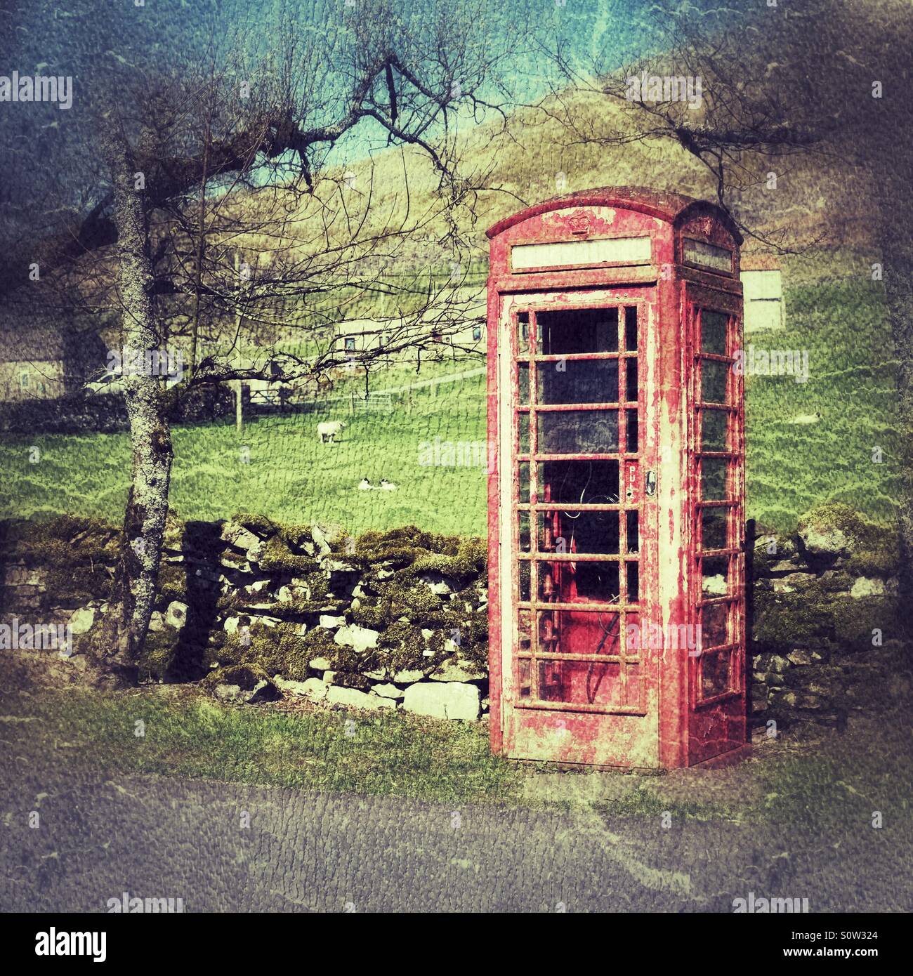 Abandoned red english telephone box. Stock Photo