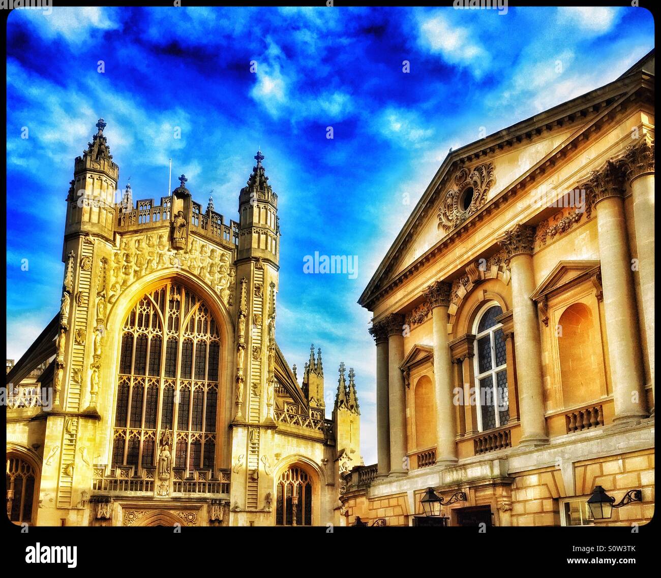 A view of Bath Abbey on the left, and The Pump Rooms on the right, in the City of Bath, England. Bath is a UNESCO World Heritage Site. Photo Credit - © COLIN HOSKINS. - Smartphone Captured Stock Image