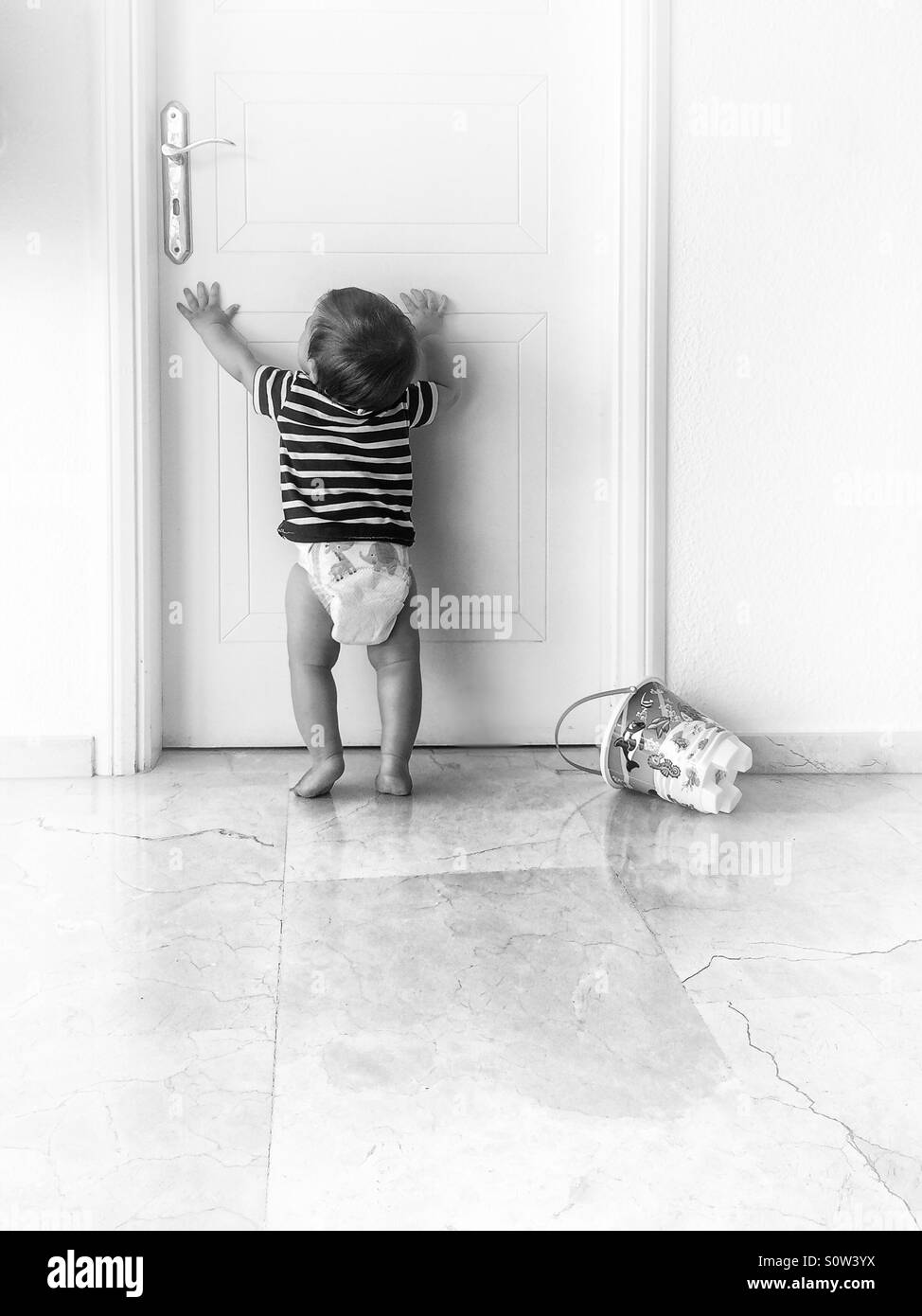 Baby reaching up Black and White Stock Photos & Images - Alamy