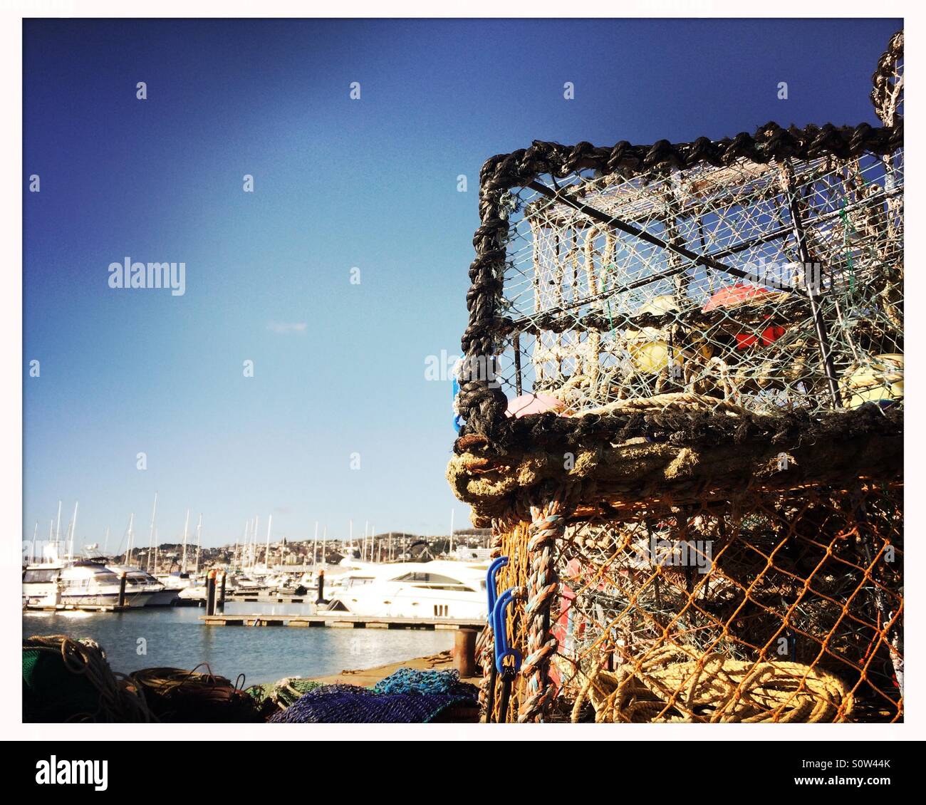 Crab pots at the harbour in Torquay Stock Photo Alamy