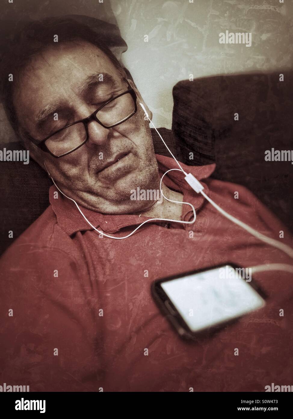 Man asleep on phone - Smartphone Captured Stock Image