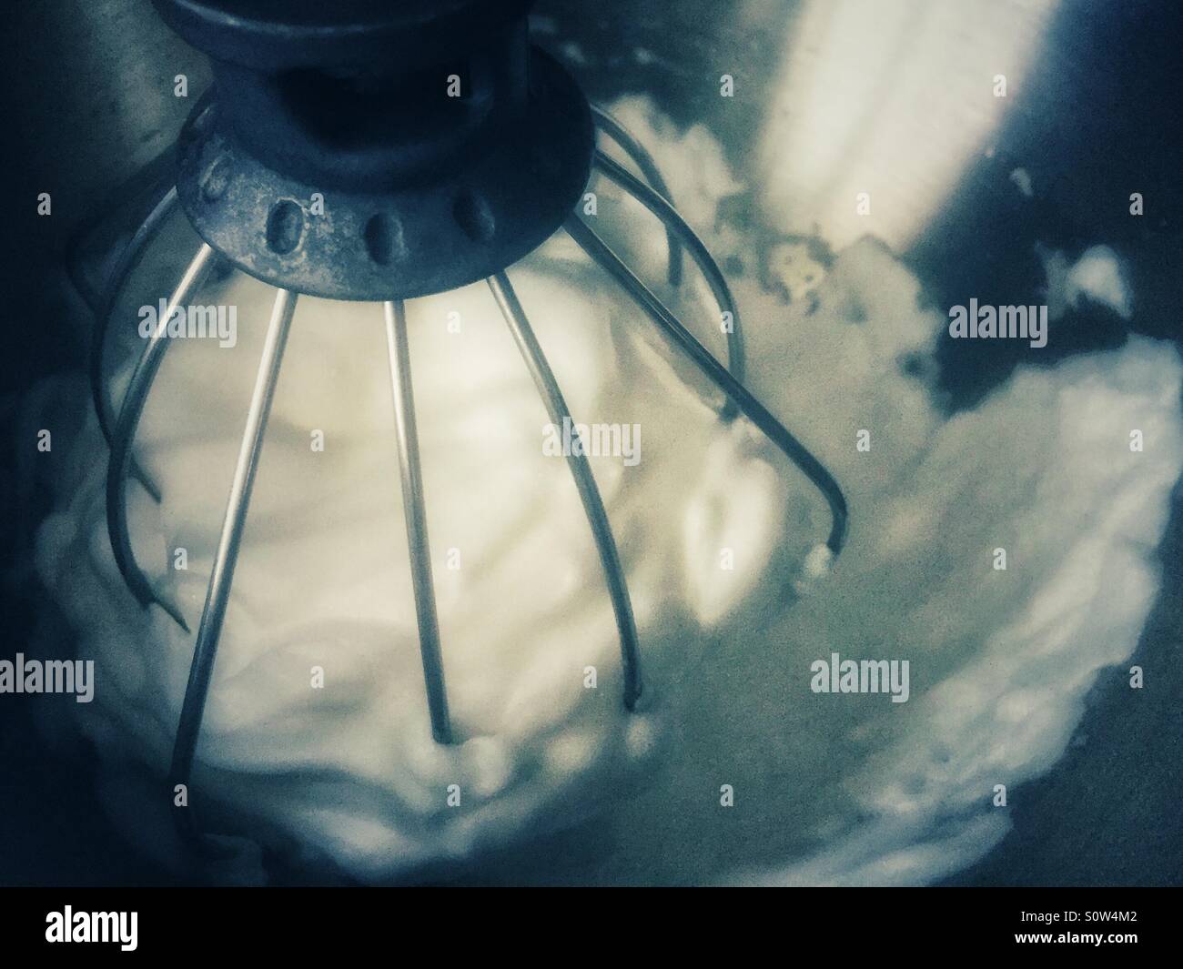 Beating egg whites in an electric mixer. Cool edit Stock Photo Alamy