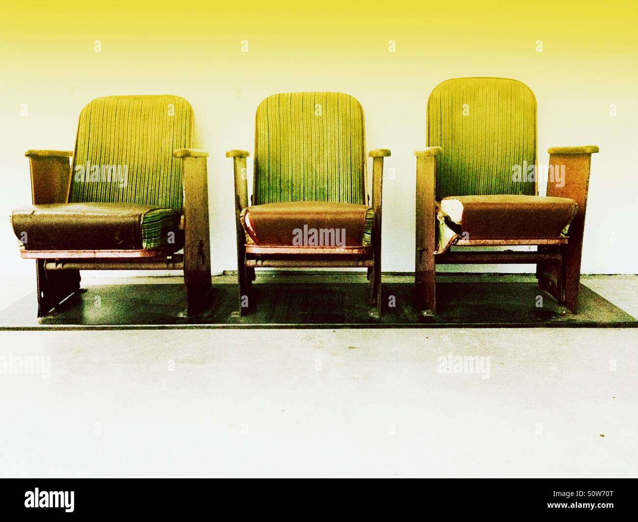 Three vintage movie seats in a row Stock Photo Alamy