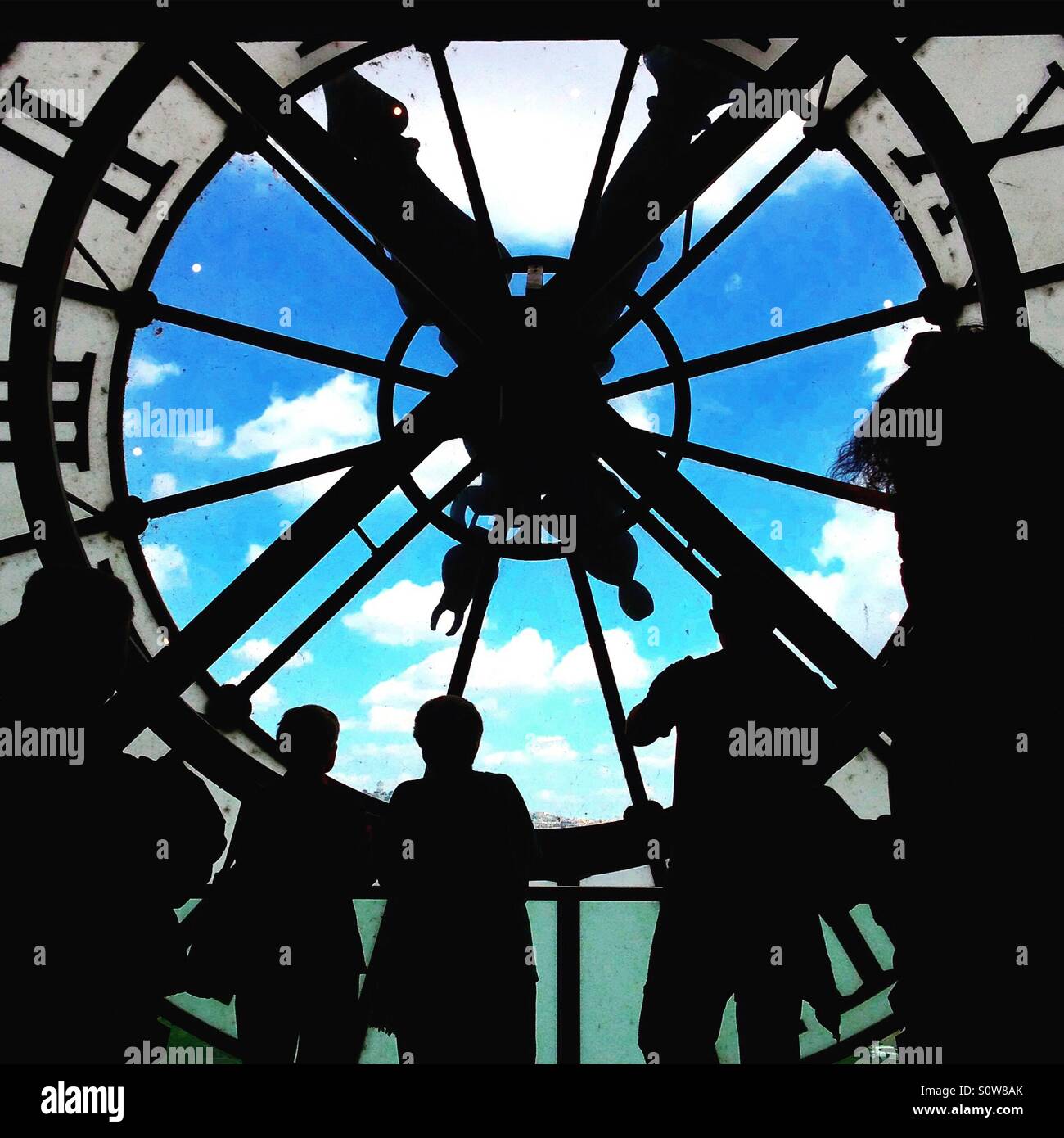 Silhouettes of tourists at the Musee de Orsay clock in Paris - Smartphone Captured Stock Image