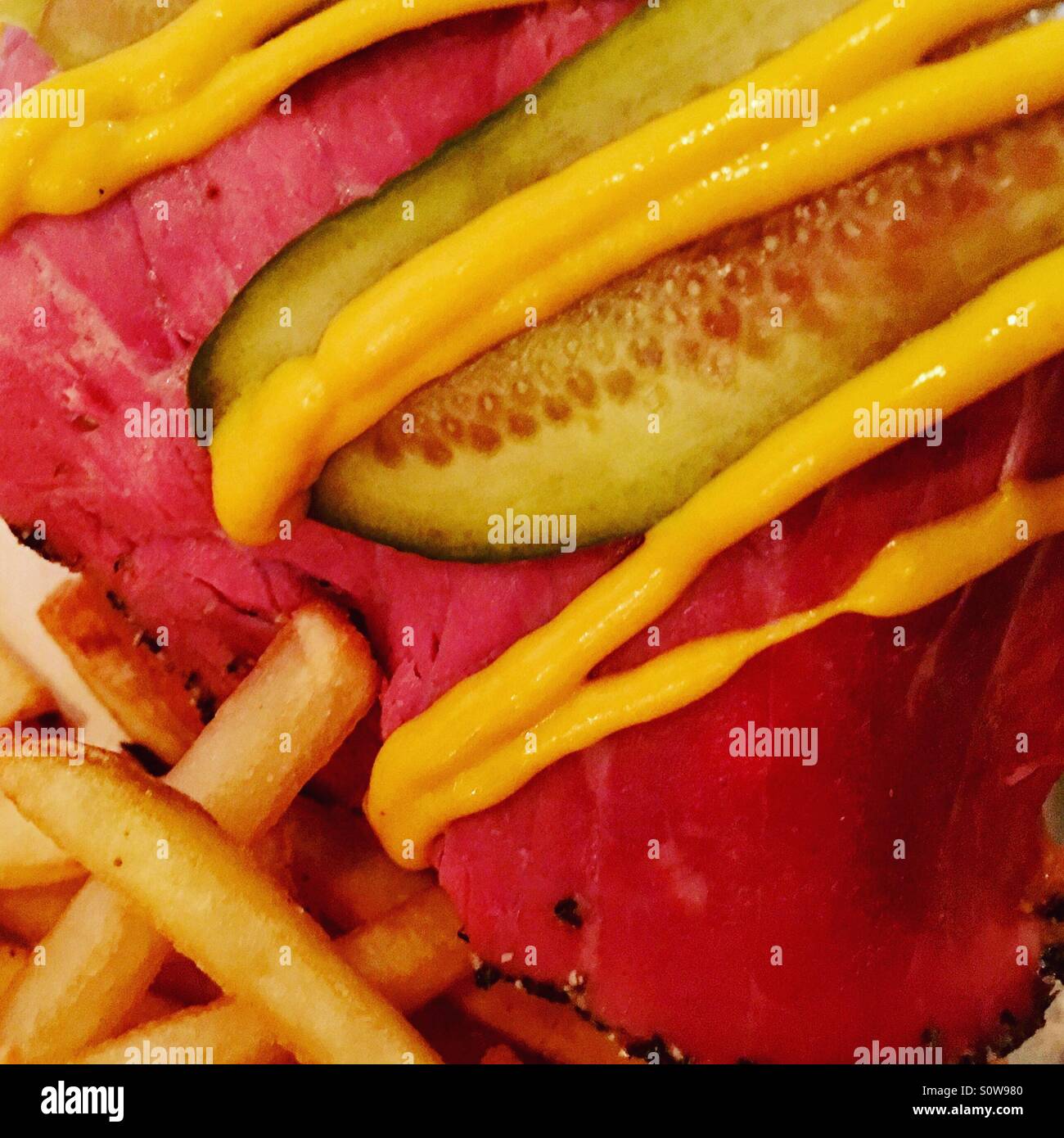 Open pastrami sandwich with pickle, mustard and French fries Stock Photo Alamy