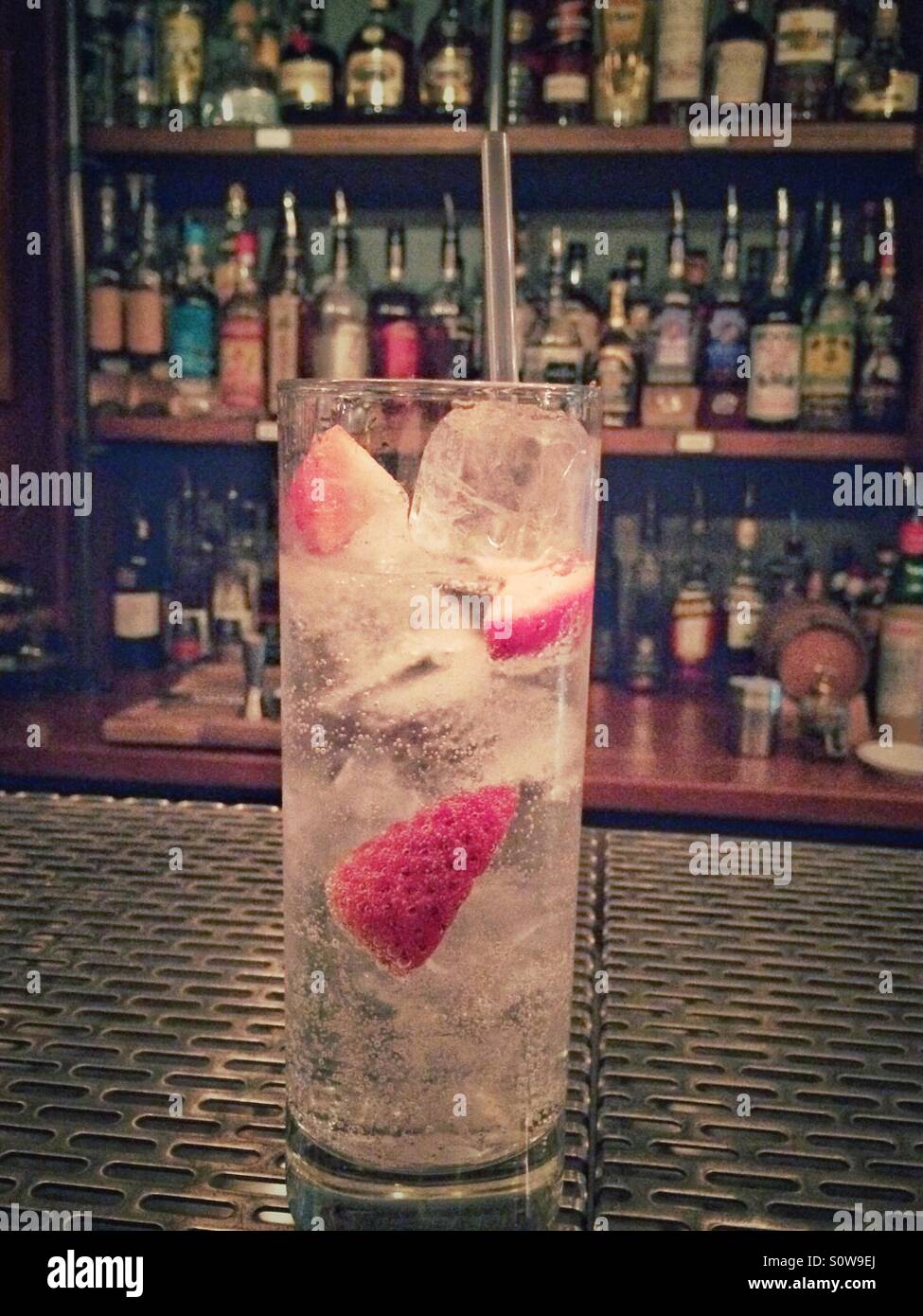 Gin and tonic with strawberry. - Smartphone Captured Stock Image