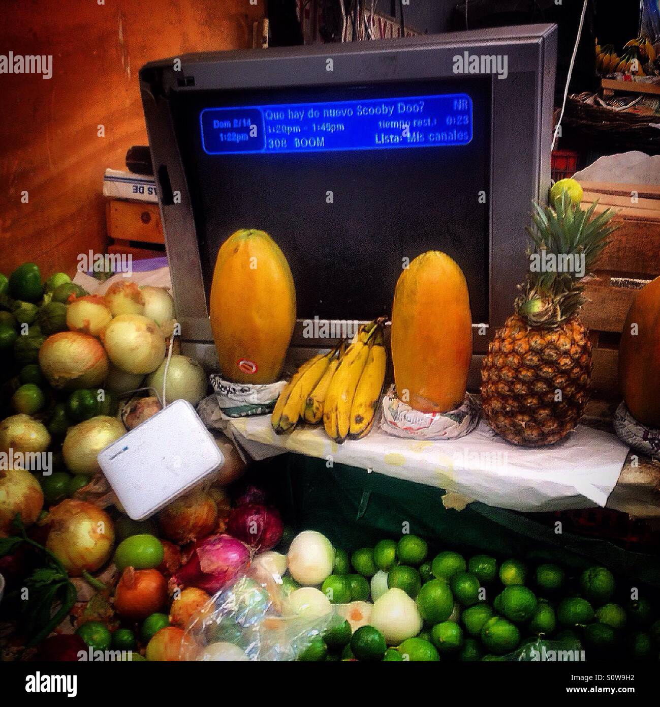 Fruit around a television in Medellin Market in Colonia Roma, Mexico City, Mexico - Smartphone Captured Stock Image