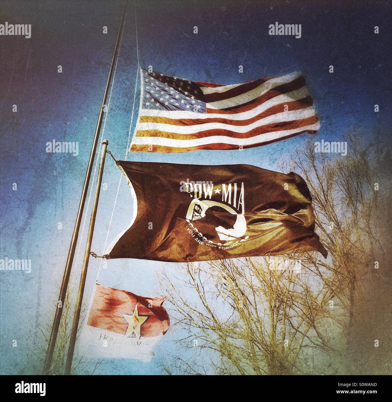 The American flag being flown with the Honor and Remember, and the POW-MIA flags. - Smartphone Captured Stock Image The American flag being flown with the Honor and Remember, and the POW-MIA flags. - Smartphone Captured Stock Image