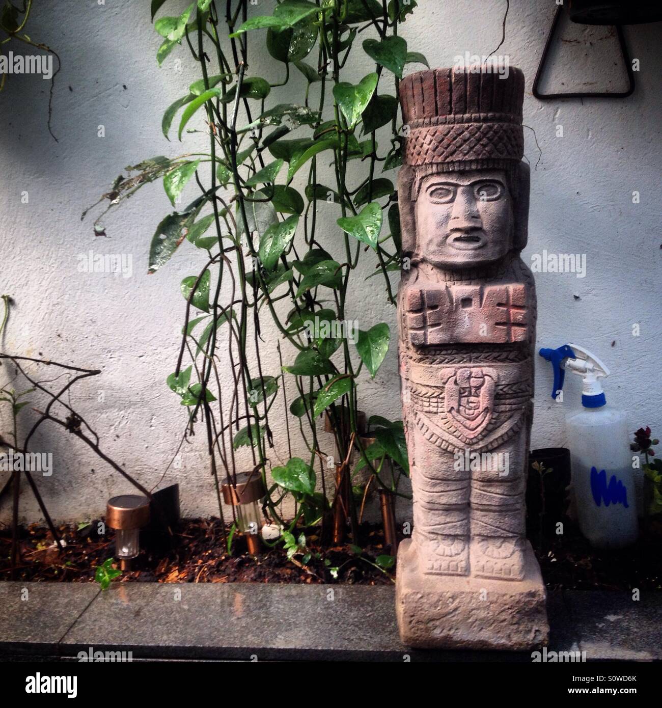 A reproduction of an Atlantean from Mesoamerican city of Tula decorates a garden in Mexico City, Mexico Stock Photo