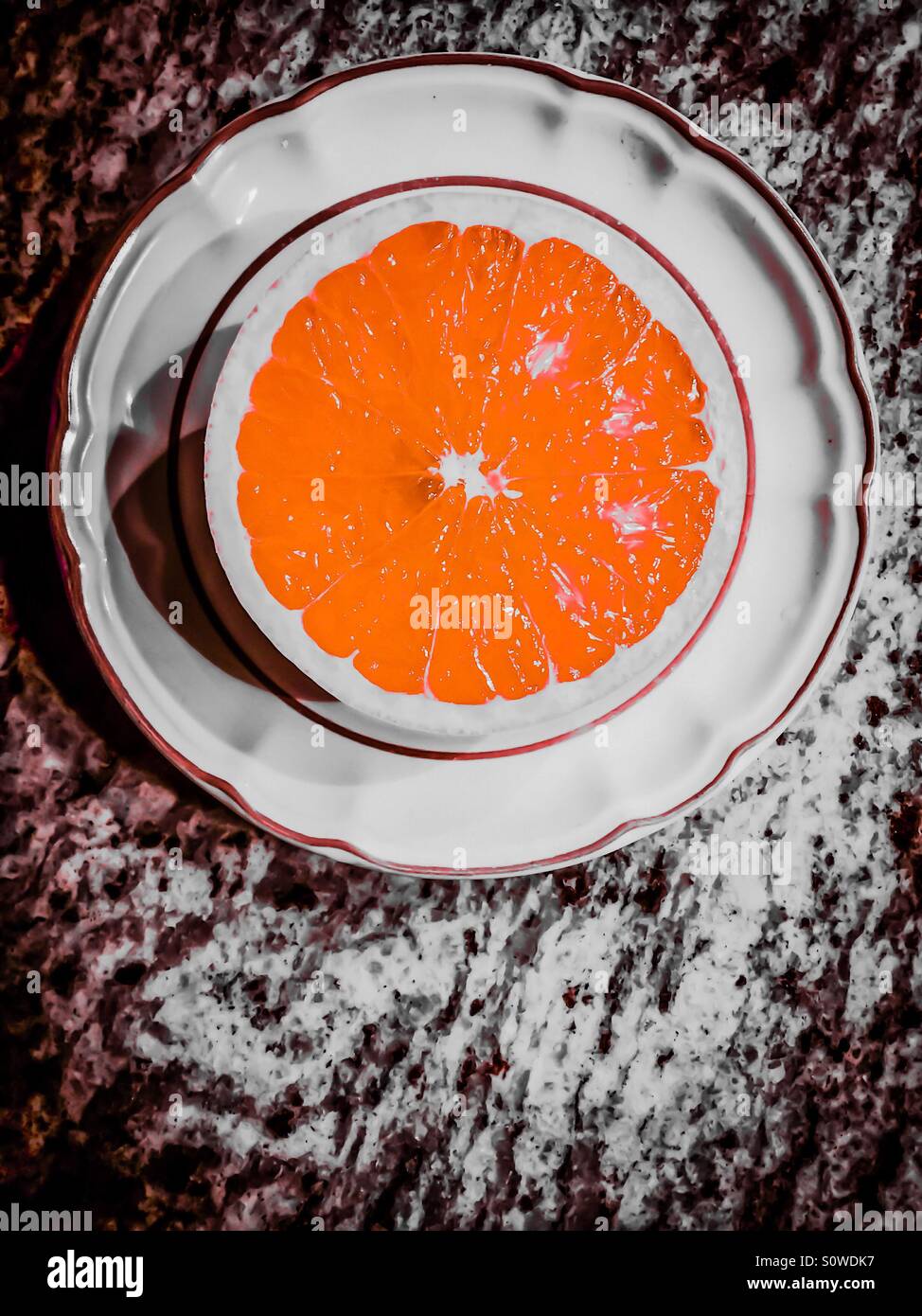 Half orange, selective colour - Smartphone Captured Stock Image