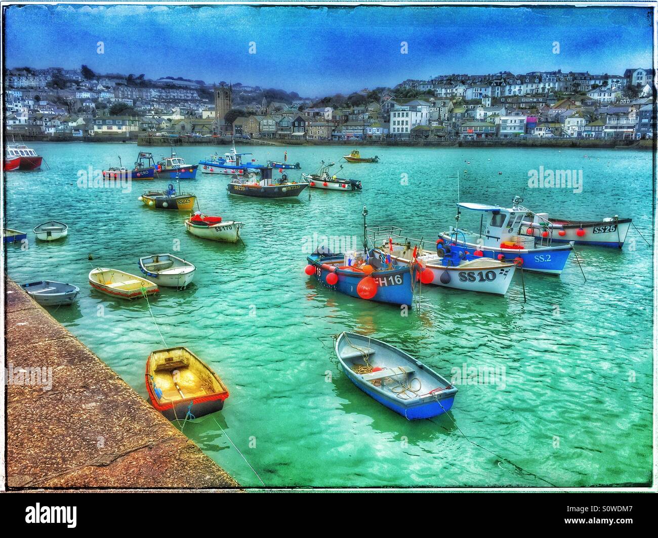 Small Boats in St. Ives Harbour. A view from Smeaton's Pier across The Harbour to the town of St. Ives, Cornwall, England. Photo Credit - © COLIN HOSKINS. - Smartphone Captured Stock Image