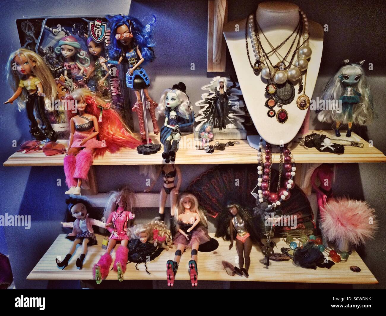 Shelves of dolls and jewellery in a quirky bedroom Stock Photo