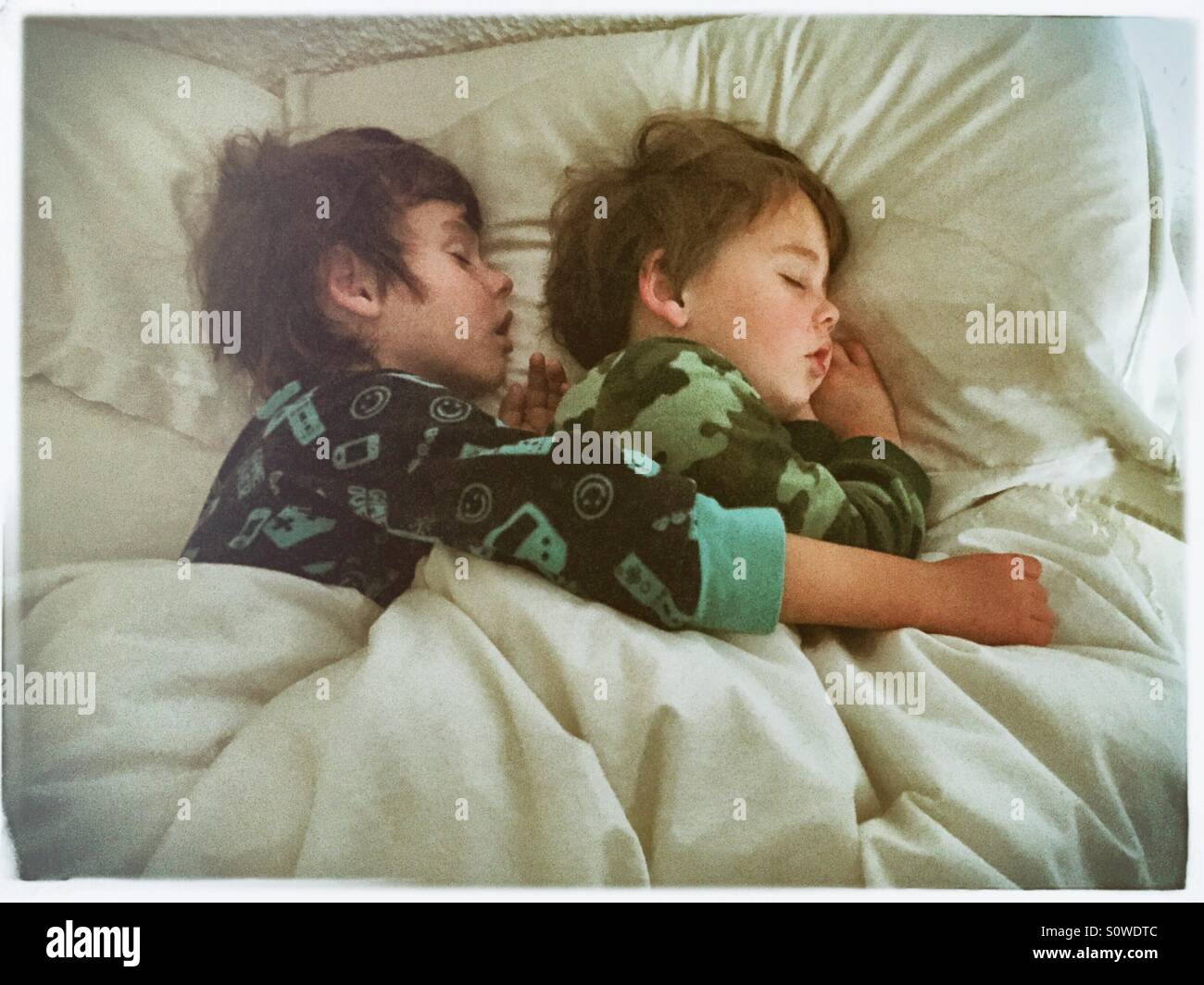 Brothers sleeping Stock Photo
