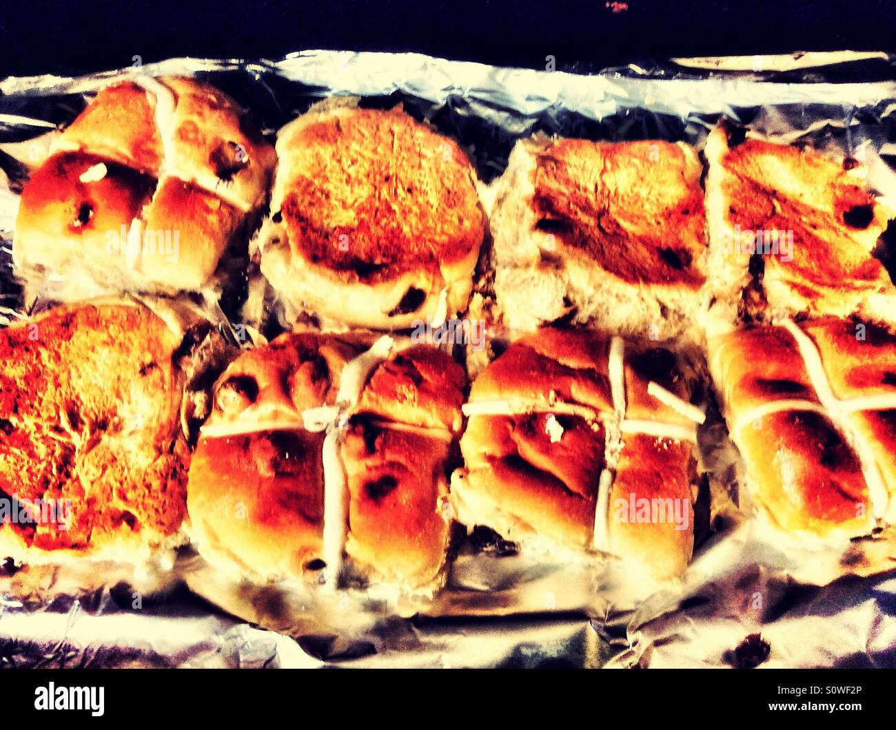 Hot cross buns on a grill pan. Stock Photo