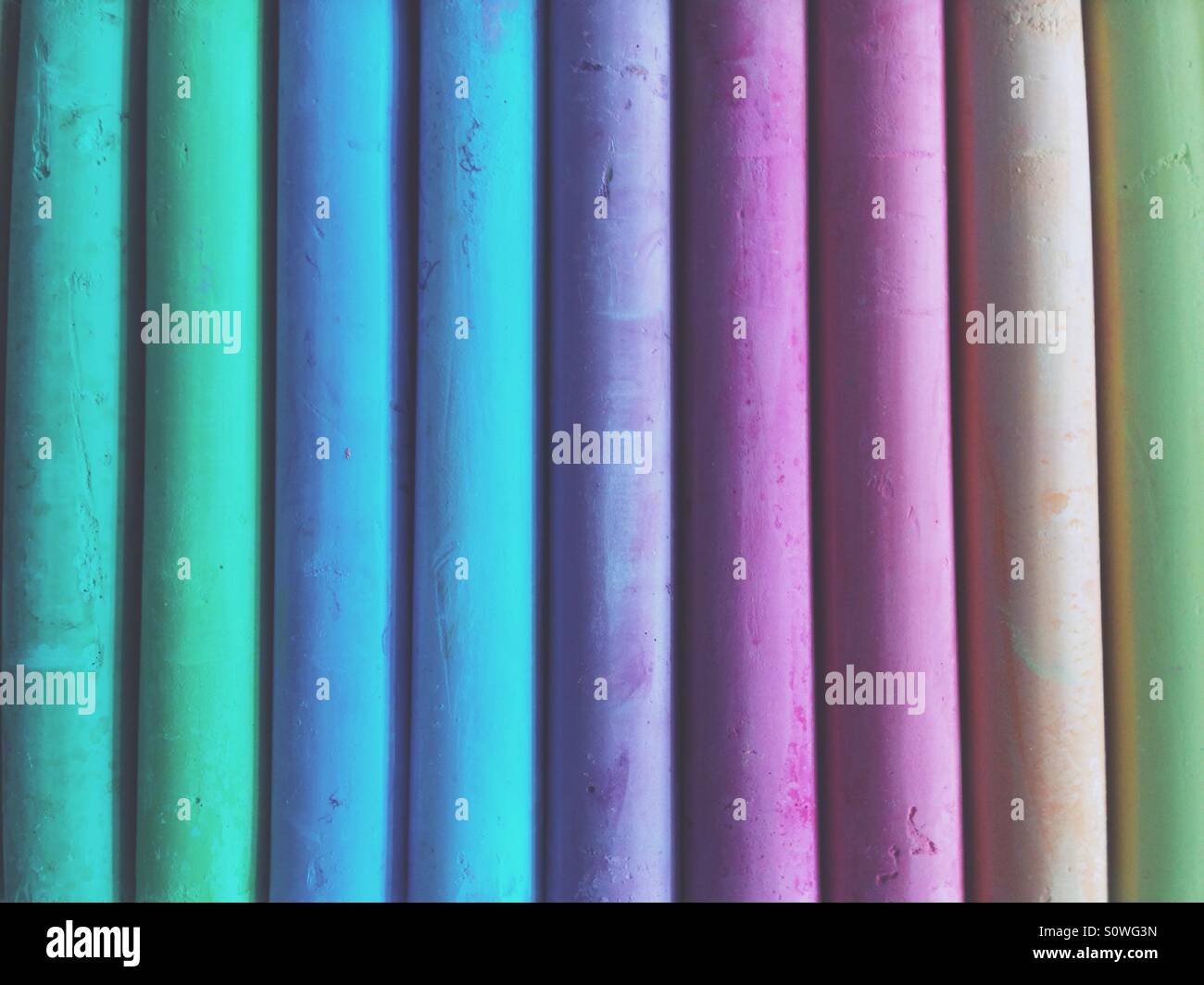 Sticks of pastel coloured chalk Stock Photo