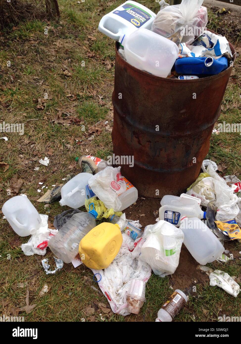 Overflowing trashcan. Stock Photo