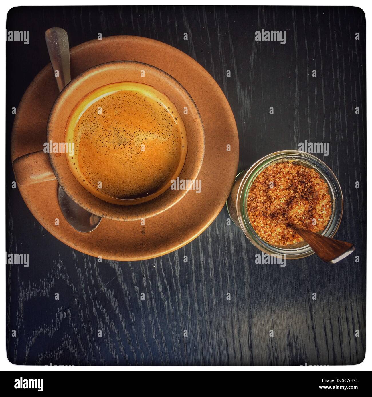 Black coffee & brown sugar. - Smartphone Captured Stock Image