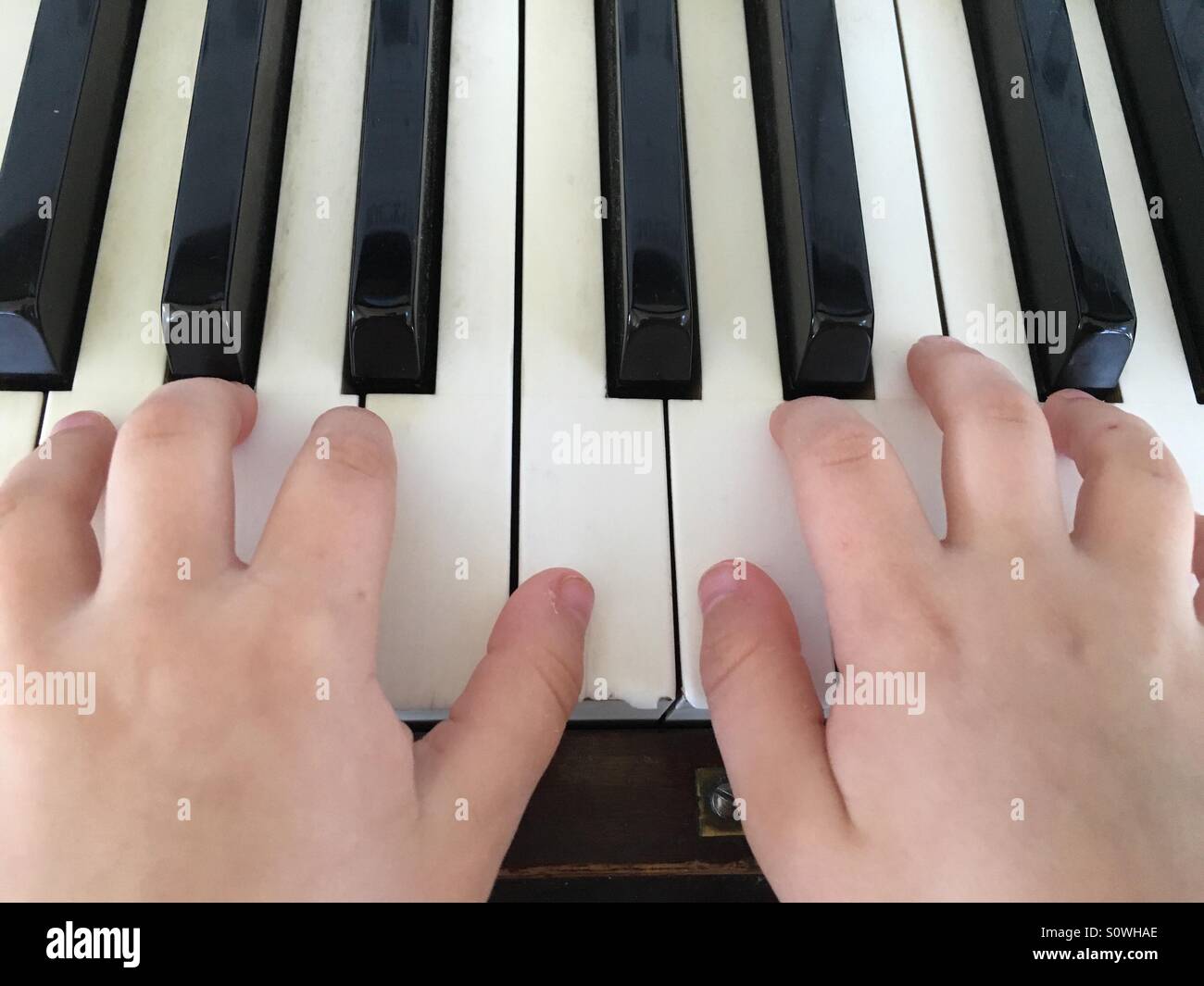 Little Kid Learning to Play Piano Stock Photo Alamy