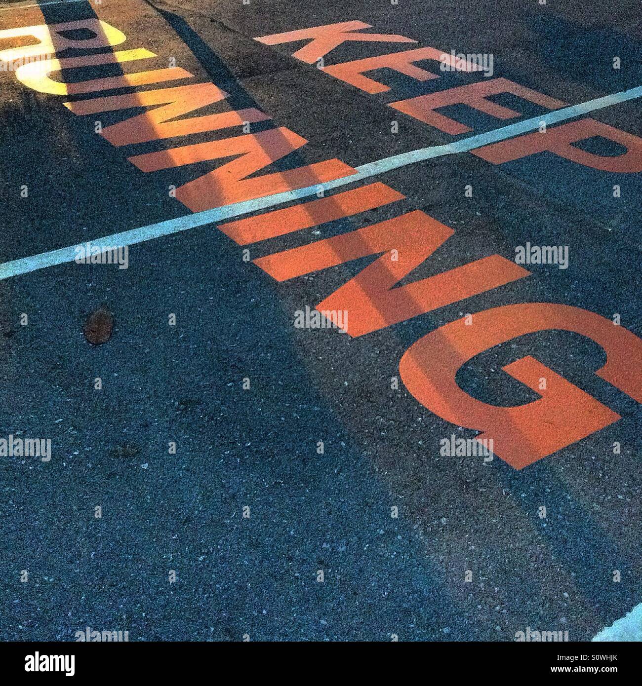 The word sign Keep running on street Stock Photo Alamy
