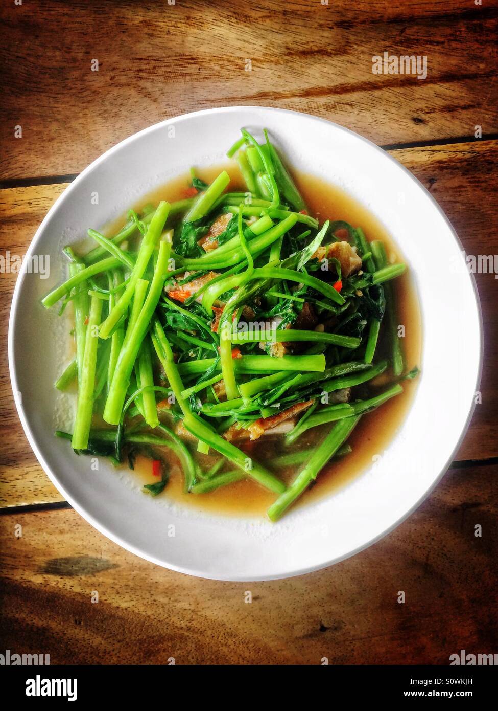 Stir fried Chinese water morning glory Stock Photo Alamy