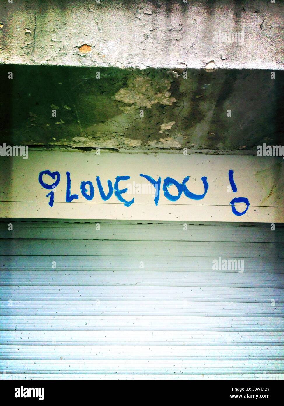 I love you graffiti above a closed window - Smartphone Captured Stock Image
