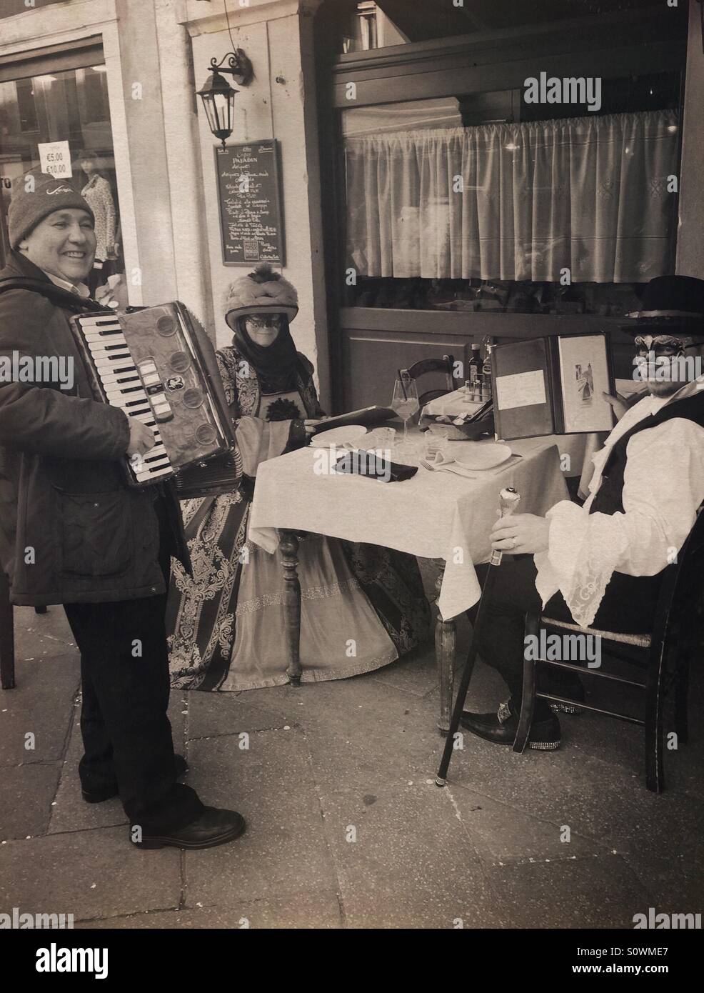 Romantic lunch, Venice carnival, Italy - Smartphone Captured Stock Image